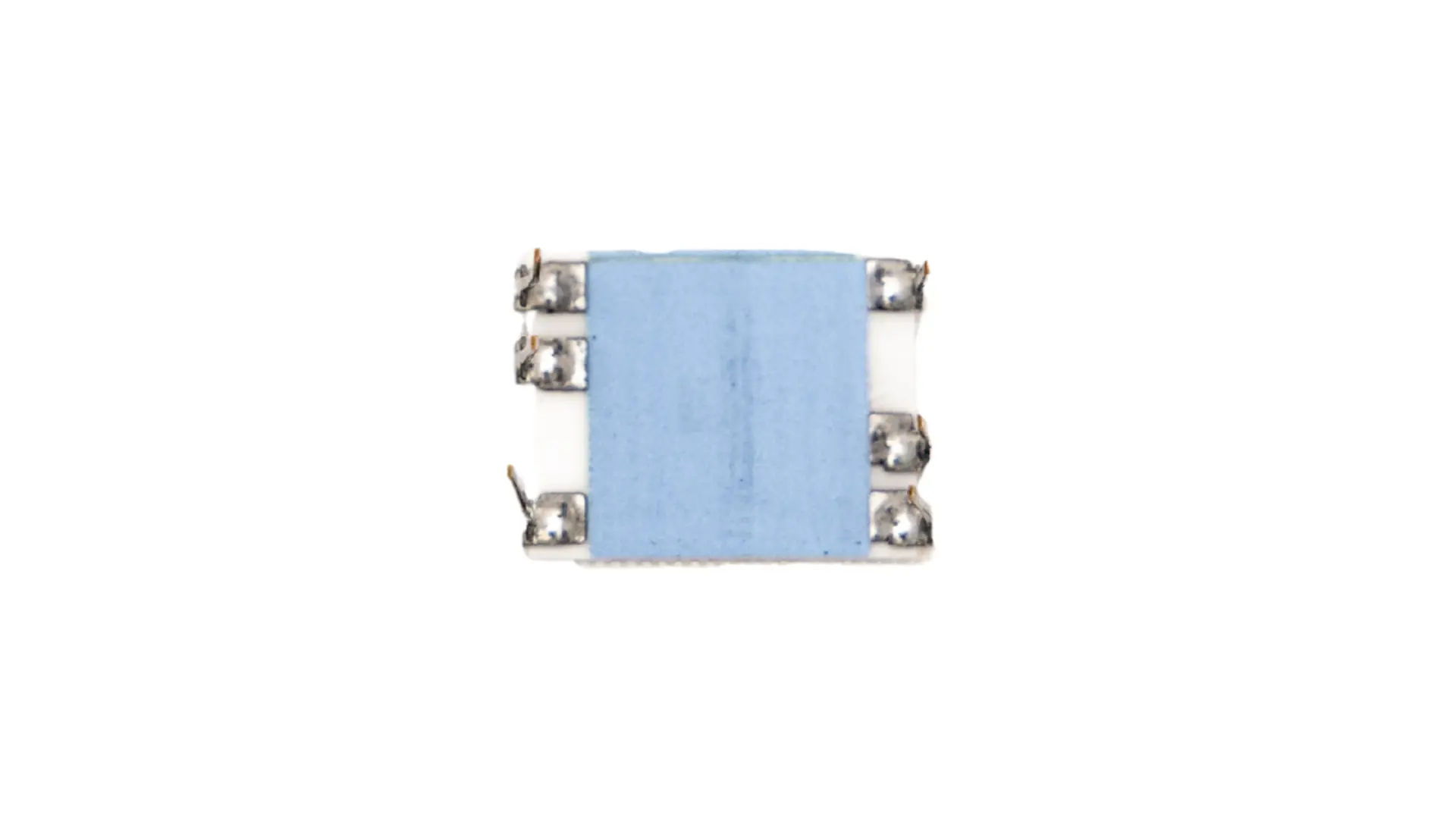 top view of a miniaturized thick film electronic component with light blue coating and metal solder terminals on the sides